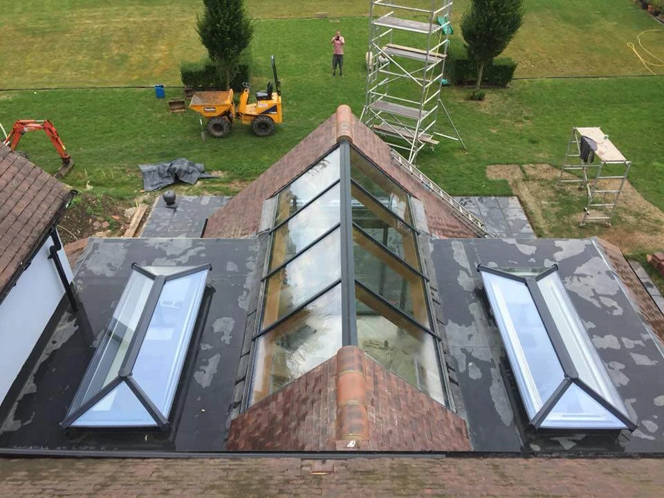 Roof mid-refurbishment with glazed roof lantern, skylights and scaffolding